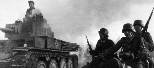 German motorcycle troops and armor advance in World War II. National Archives photo.