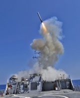 US Navy ship launches a missile toward Libya during opening phase of Operation Odyssey Dawn. US Navy photo.