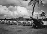 The 27th Division Cemetery in 1945 in Susupe, Saipan. Mount Topochau lies directly behind the American Flag.