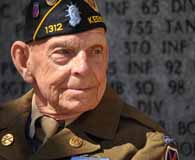 Charlie Smith, a World War II veteran of the 10th Mountain Division's 85th Infantry Regiment, pays tribute to his fallen comrades at the Florence American Cemetery in northern Italy.  (Sgt. 1st Class John Queen)