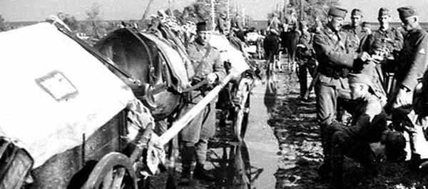 Hungarian troops navigates a thawing country road while occupying an area in the Ukrainian countryside.