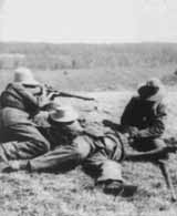 Boer fighters treat a wounded soldier.