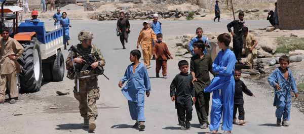 A group of curious boys follows Sgt. Brian Baker, a medic with 101st Airborne Division, as he prepares to mount up in a vehicle after completing a patrol on June 25, 2012 in Marawara with soldiers from Company B, 2d Battalion, 12th Infantry Regiment, 4th Brigade Combat Team, 4th Infantry Division. Marawara was one of several targets in the opening evening of a Taliban offensive in Kunar Province in August 2012. (Army Sgt. Andrea Merritt)