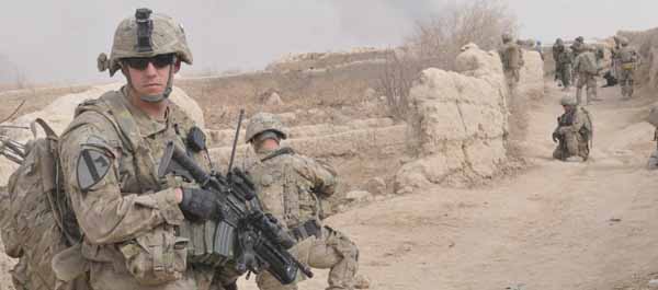 Sgt. Joshua Oakley of 25th Infantry Division pulls rear security while on patrol in the village of Shengazi, Afghanistan on Jan. 3. (Army Sgt. Michael Blalack)