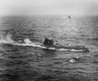 Soviet submarine B-59 on surface with a U.S. Navy  helicopter flying above. National Security Archive, U.S. Navy